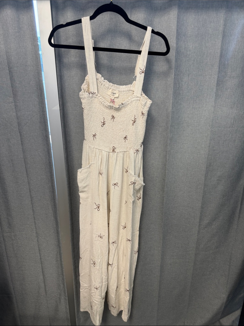 Umgee Cream Smocked Jumpsuit with Small Brown Bow Print